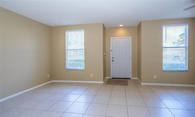a view of an empty room with a window