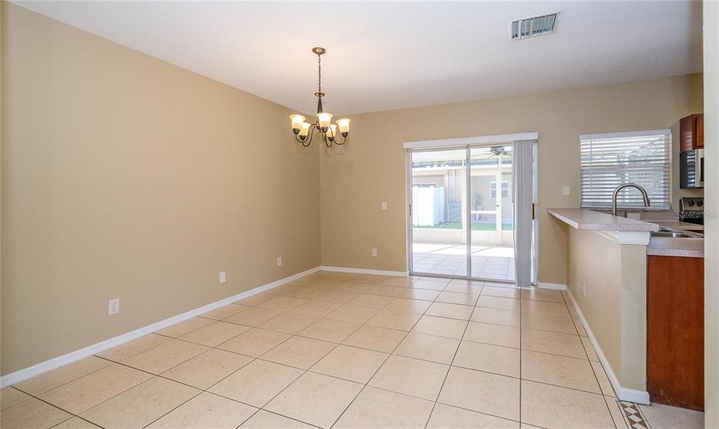 1238 Beckenham Way Wesley Chapel, FL 33543 - Photo 7 of 31 a view of kitchen with granite countertop cabinets and sink