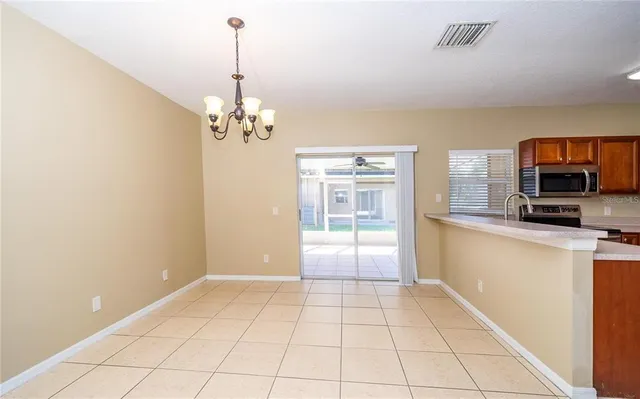 a view of a kitchen with a sink dishwasher and a refrigerator