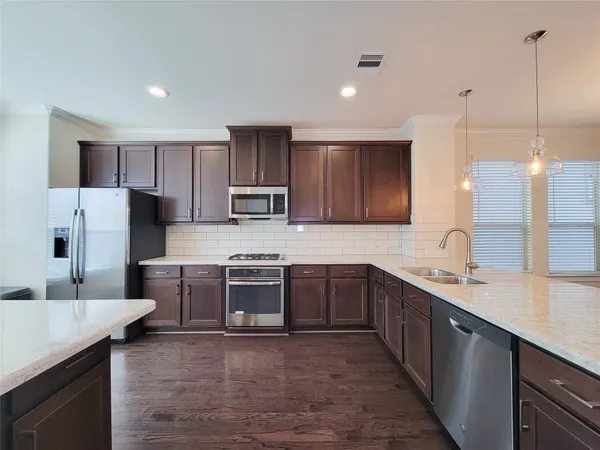 a large kitchen with cabinets
