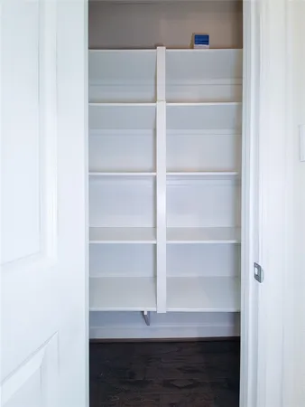 a view of storage and utility room with empty racks