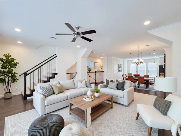 a living room with furniture or couches and a potted plant