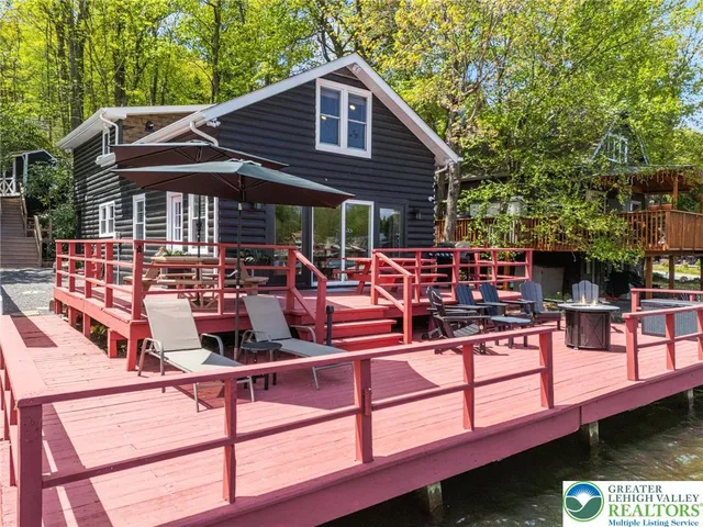a view of a chairs and table in the balcony