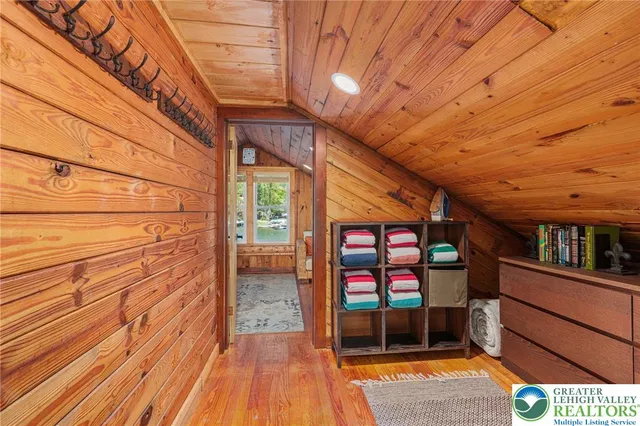 a view of a porch with wooden floor and iron stairs