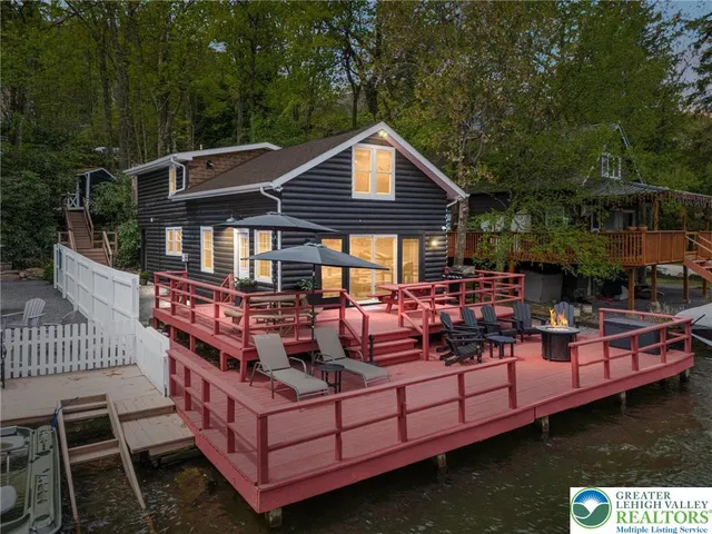 a view of a patio with couches chairs and a table of the balcony