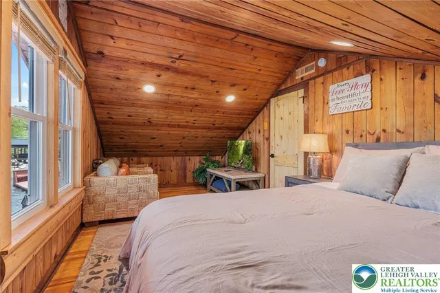 a bedroom with bed and window