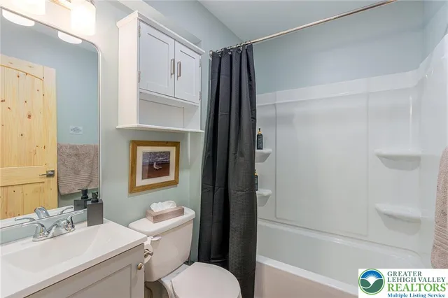 a view of a balcony with two chairs and a table