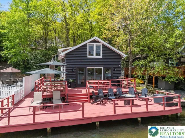 a view of a patio with table and chairs and potted plants