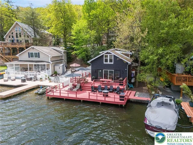 an aerial view of a house with a big yard