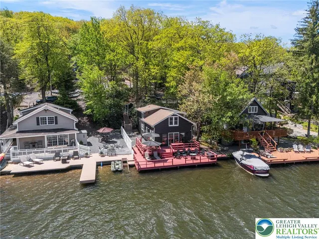 an aerial view of a houses with ocean view