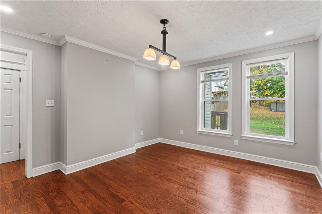 532 Park Road Ambridge, PA 15003 - Photo 14 of 37 a view of an empty room with wooden floor and a window