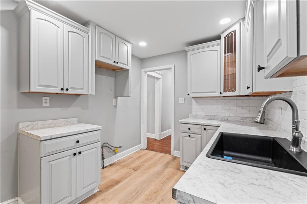 532 Park Road Ambridge, PA 15003 - Photo 8 of 37 a kitchen with stainless steel appliances granite countertop a stove a sink and a refrigerator