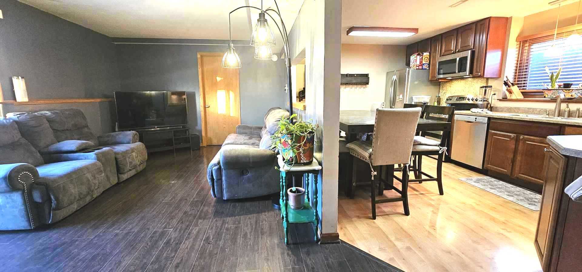 968 Coventry Lane Crystal Lake, IL 60014 - Photo 12 of 19 a living room with furniture dining table and wooden floor