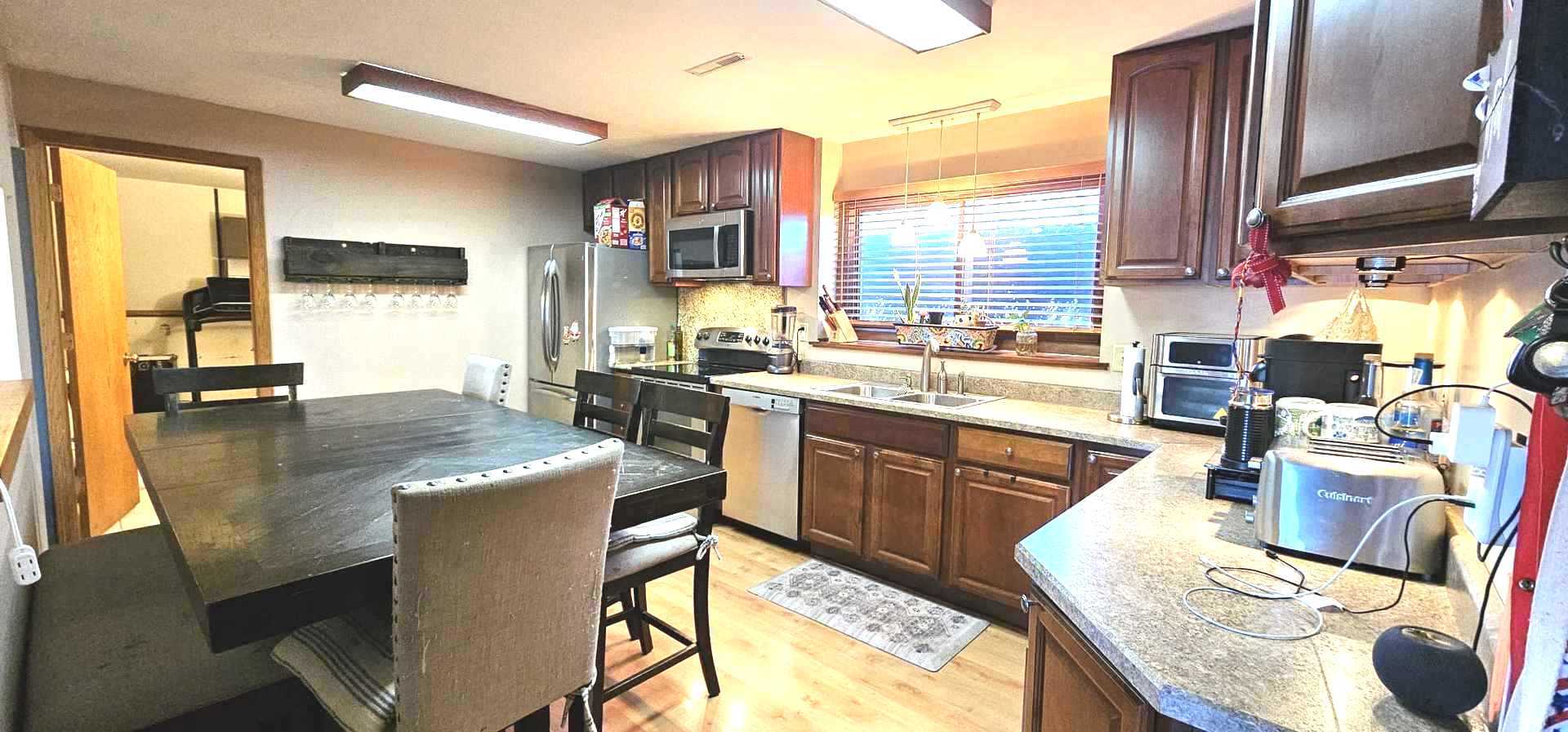 968 Coventry Lane Crystal Lake, IL 60014 - Photo 14 of 19 a kitchen with stainless steel appliances granite countertop a sink and a refrigerator