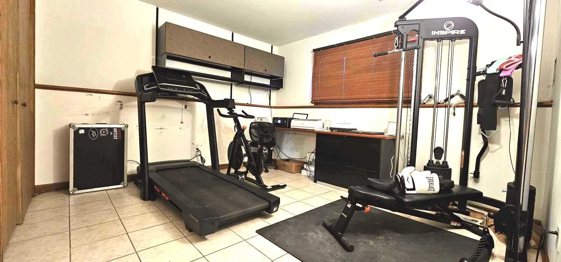 968 Coventry Lane Crystal Lake, IL 60014 - Photo 17 of 19 a room with gym equipment and a large window