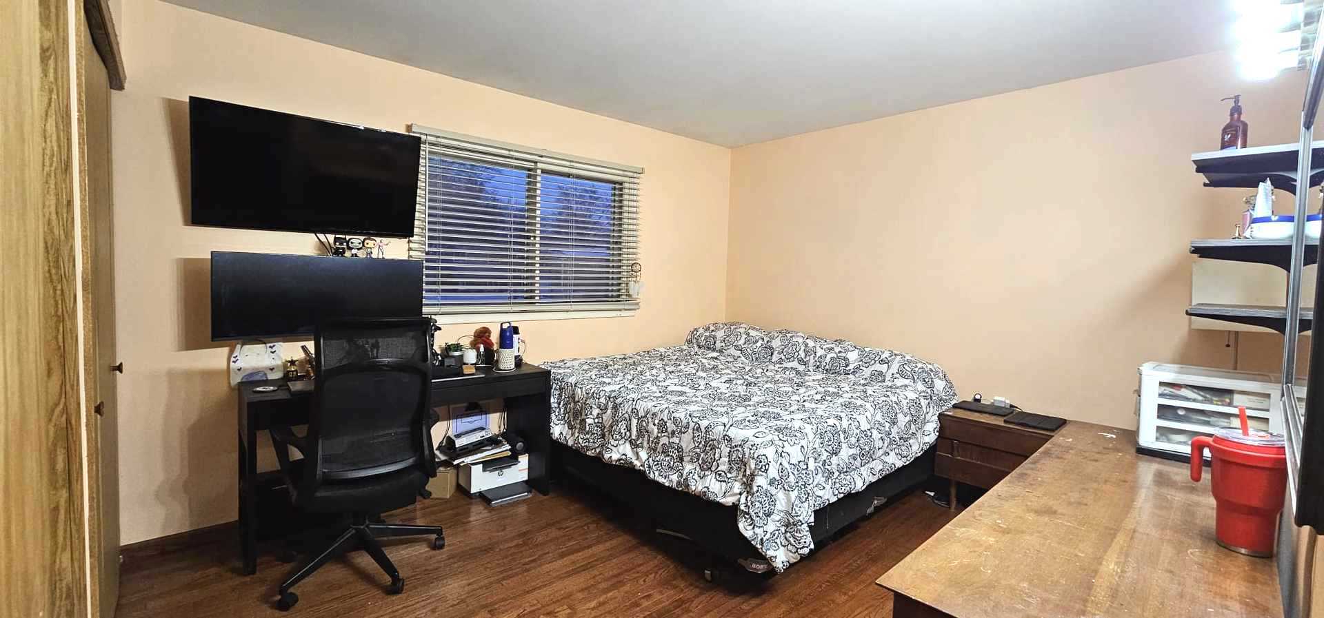 968 Coventry Lane Crystal Lake, IL 60014 - Photo 2 of 19 a bedroom with a bed and a flat screen tv