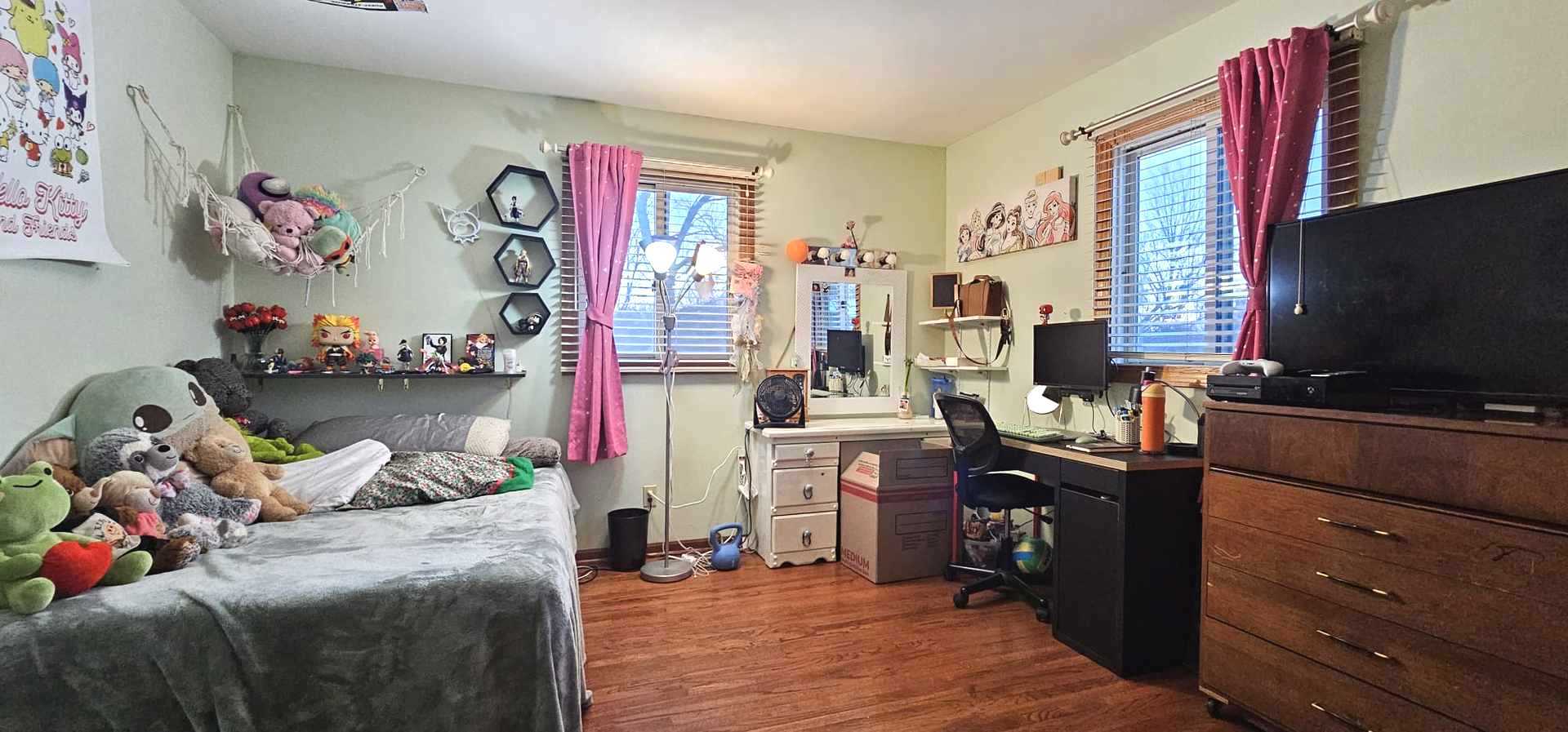 968 Coventry Lane Crystal Lake, IL 60014 - Photo 4 of 19 a bedroom with a bed and a flat tv screen on dresser