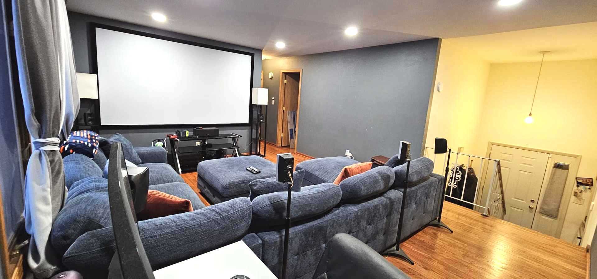 968 Coventry Lane Crystal Lake, IL 60014 - Photo 8 of 19 a media room with lots of chairs and a projector screen