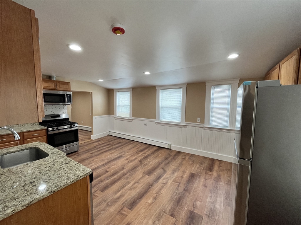 11 Benefit Terrace, Unit 3 Worcester, MA 01610 - Photo 2 of 15 a kitchen with stainless steel appliances granite countertop a refrigerator and a sink