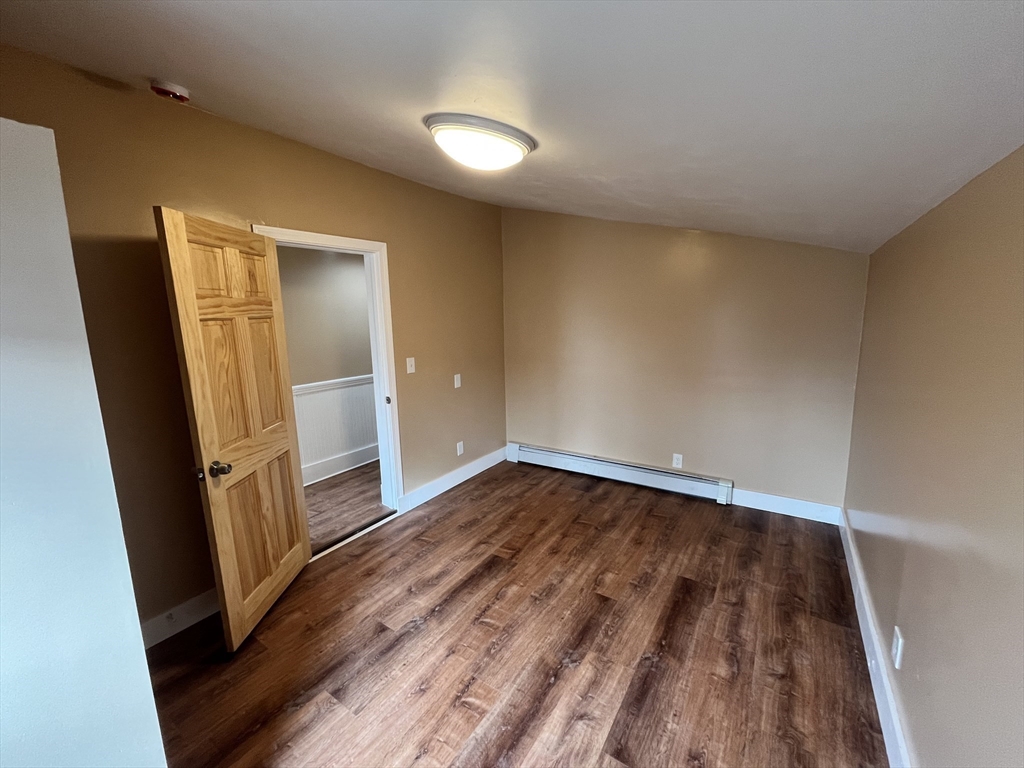 11 Benefit Terrace, Unit 3 Worcester, MA 01610 - Photo 9 of 15 wooden floor in an empty room