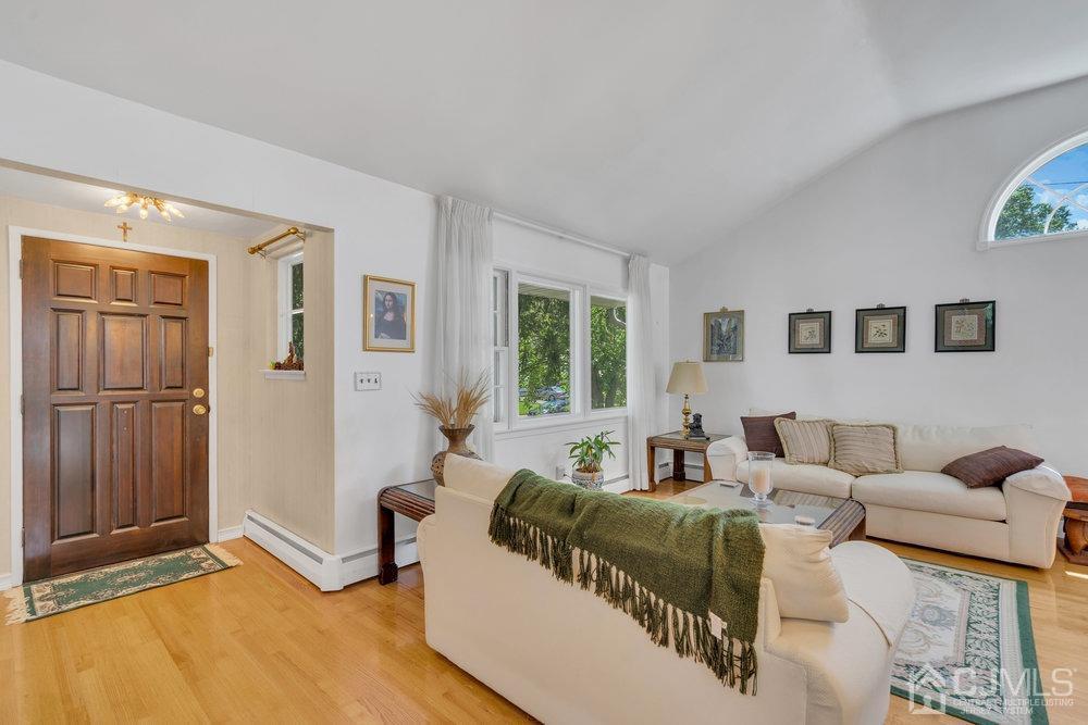 233 Amherst Avenue Colonia, NJ 07067 - Photo 12 of 56 a living room with furniture and a window