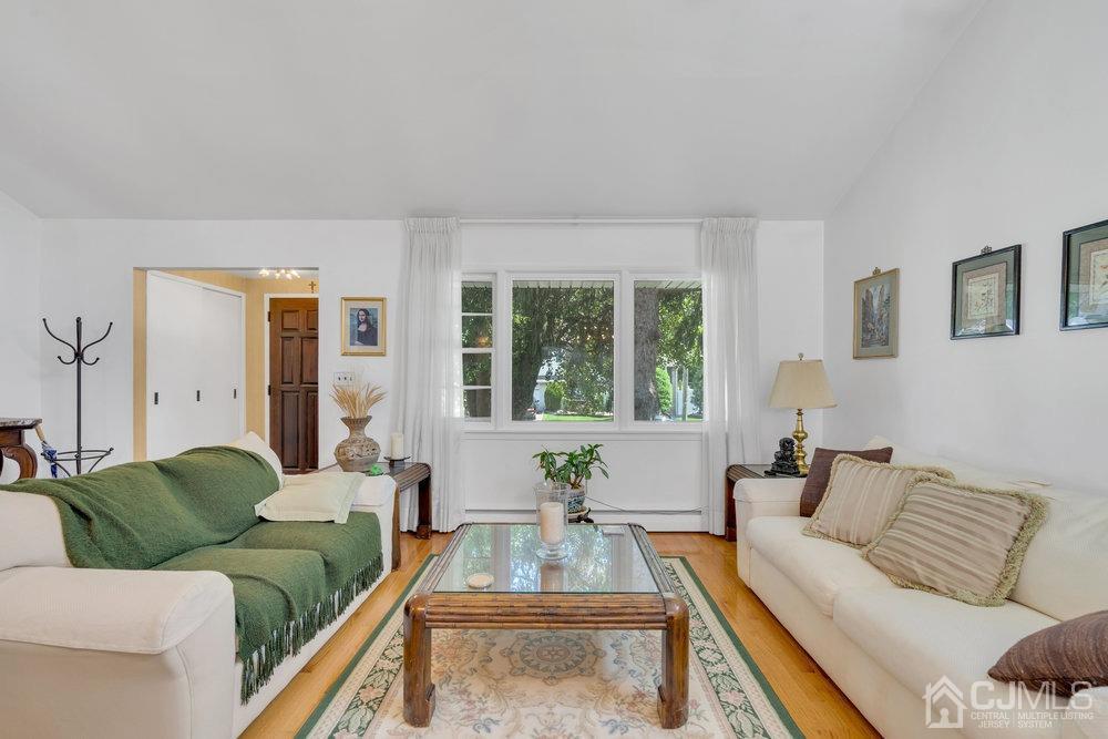 233 Amherst Avenue Colonia, NJ 07067 - Photo 14 of 56 a living room with furniture and a large window