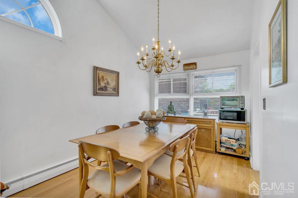 233 Amherst Avenue Colonia, NJ 07067 - Photo 19 of 56 a dining room with a table and chairs