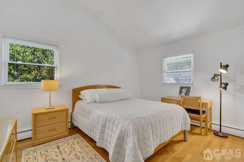 233 Amherst Avenue Colonia, NJ 07067 - Photo 21 of 56 a bedroom with a bed and a window