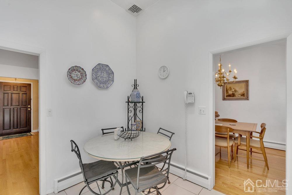 233 Amherst Avenue Colonia, NJ 07067 - Photo 31 of 56 a view of a dining room with furniture and a table