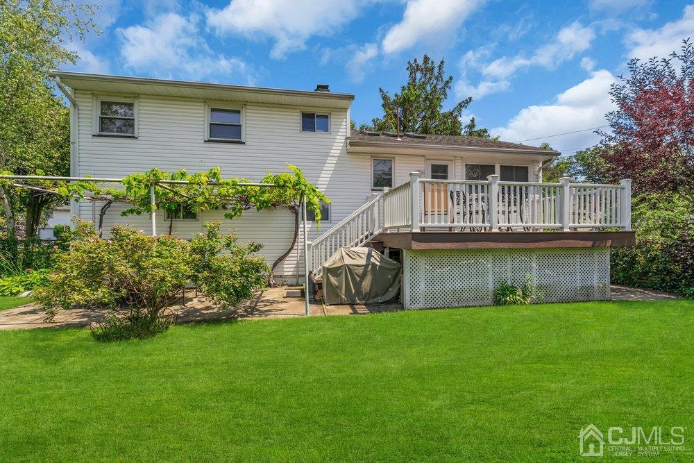 233 Amherst Avenue Colonia, NJ 07067 - Photo 40 of 56 a front view of house with a garden
