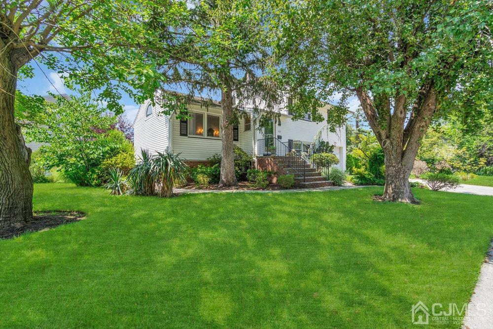 233 Amherst Avenue Colonia, NJ 07067 - Photo 4 of 56 a view of a house with a yard
