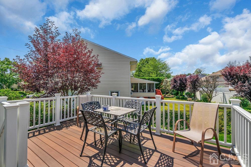 233 Amherst Avenue Colonia, NJ 07067 - Photo 46 of 56 a view of a chairs and table on the roof deck