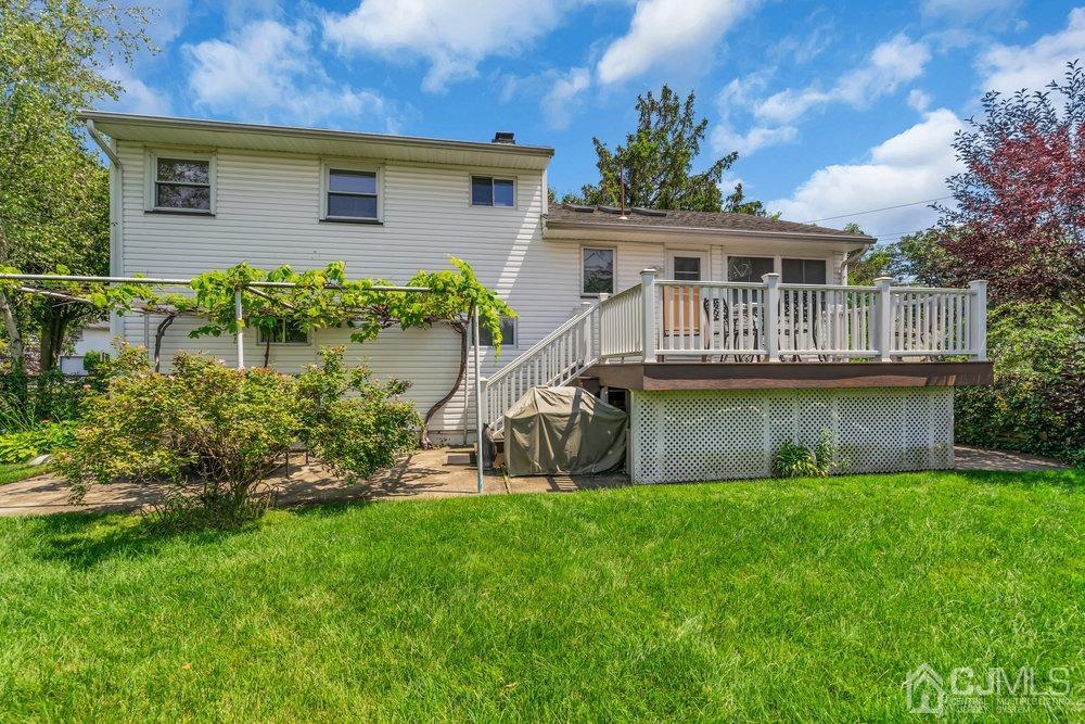 233 Amherst Avenue Colonia, NJ 07067 - Photo 53 of 56 a front view of house with a garden