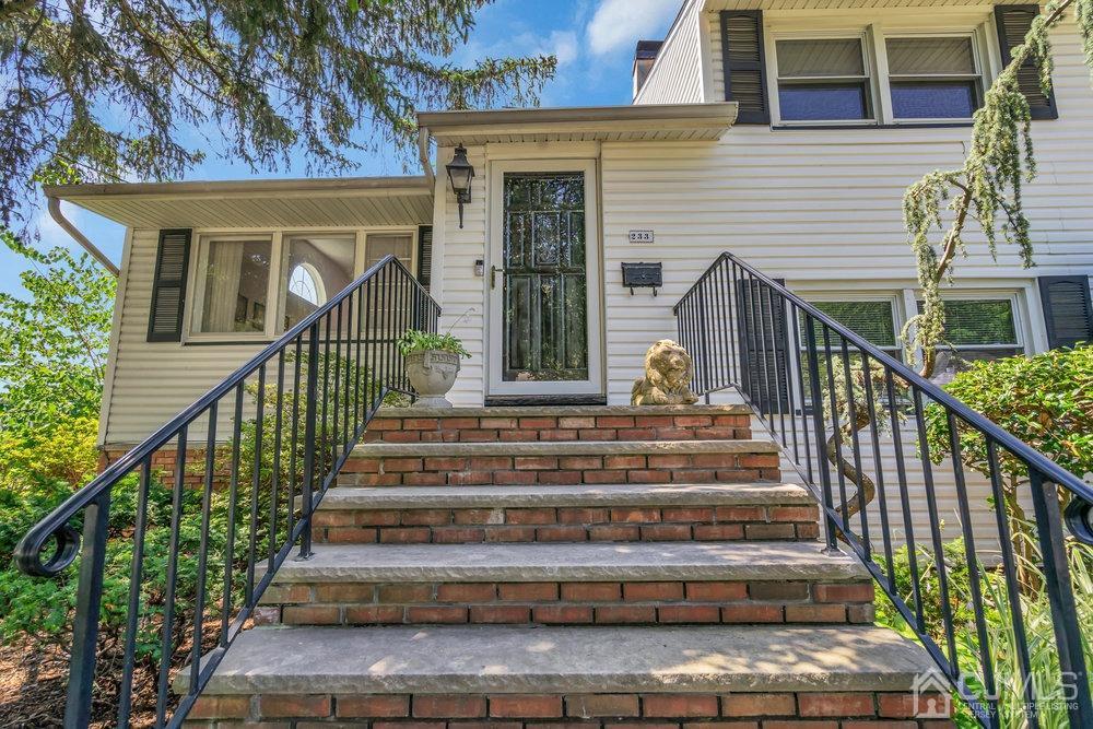 233 Amherst Avenue Colonia, NJ 07067 - Photo 9 of 56 a view of a house with wooden stairs