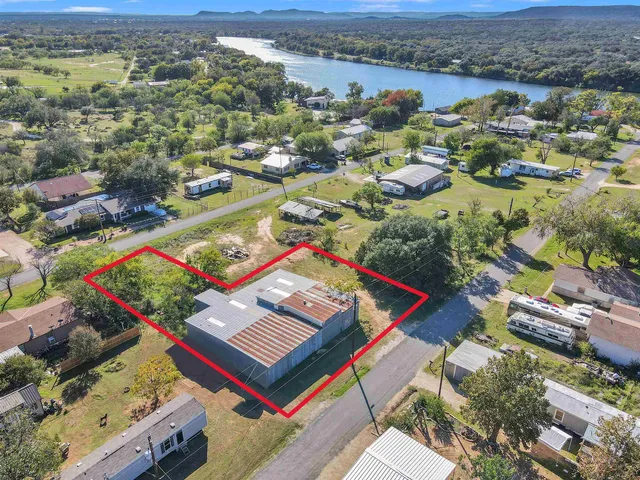 an aerial view of residential houses with outdoor space
