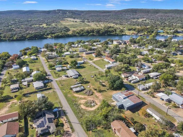 an aerial view of residential building and lake view