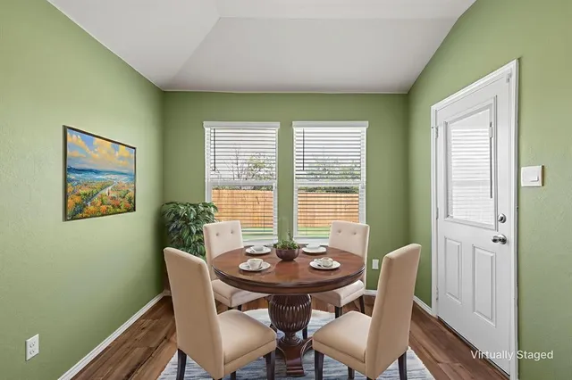 a view of a dining room with furniture window and outside view