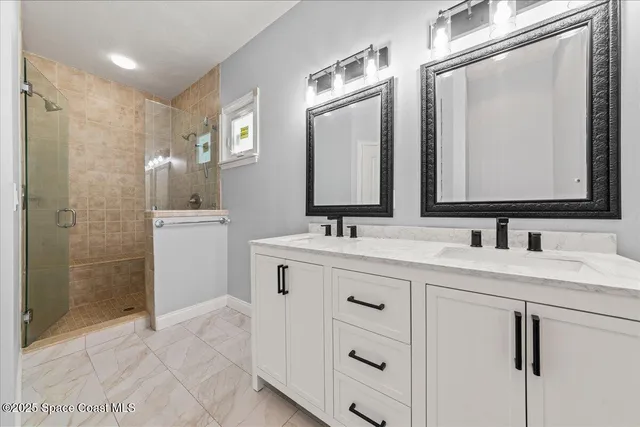a view of staircase with wooden floor and white walls