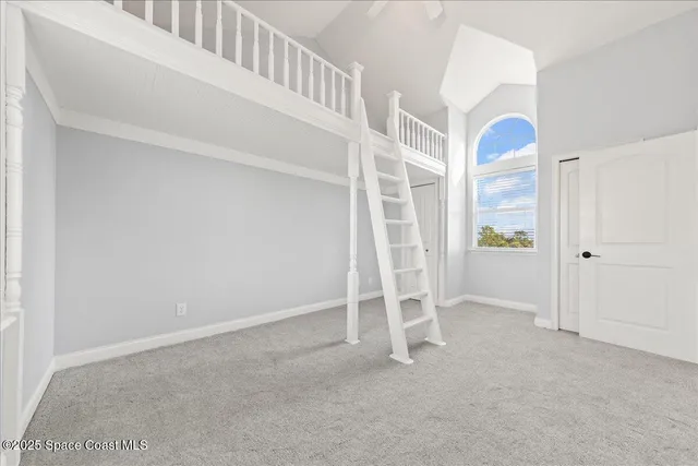 a view of a kitchen with dining table and chairs