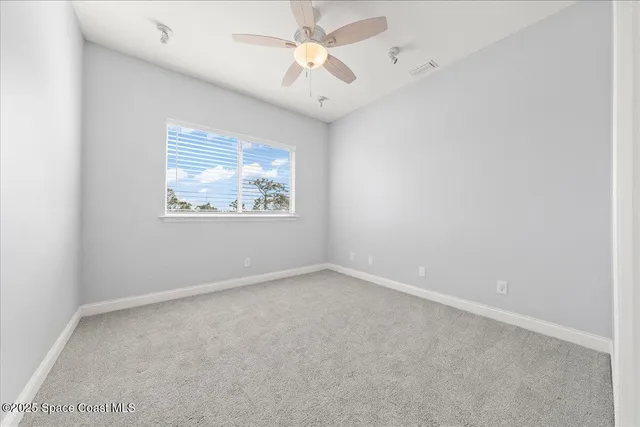 a kitchen with stainless steel appliances granite countertop a refrigerator a oven and a sink with wooden floor