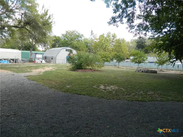 a fire hydrant in the middle of a field