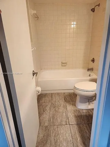 a bathroom with a sink a toilet and a bathtub