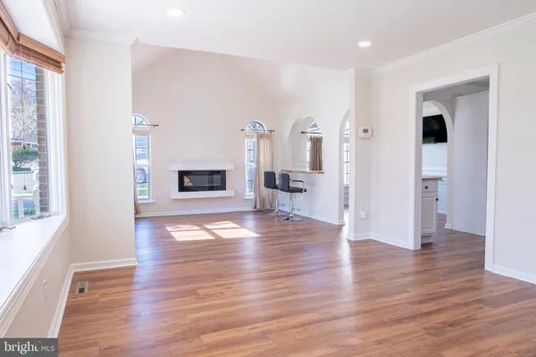 a view of a livingroom with wooden floor