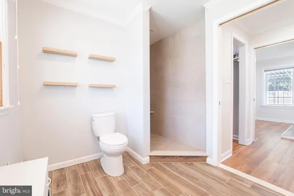 a bathroom with a toilet and a sink