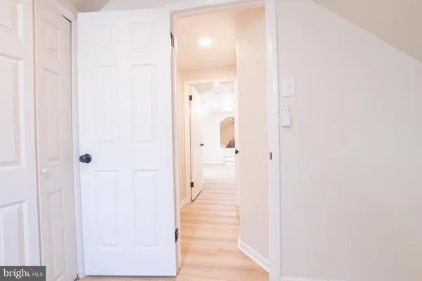 a view of a bathroom from a hallway