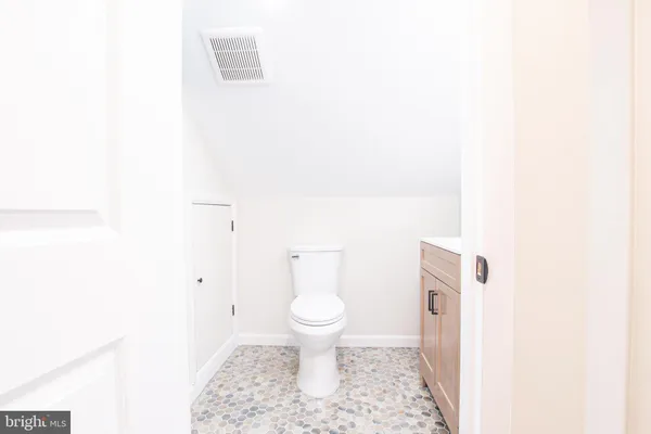 a bathroom with a toilet and a sink