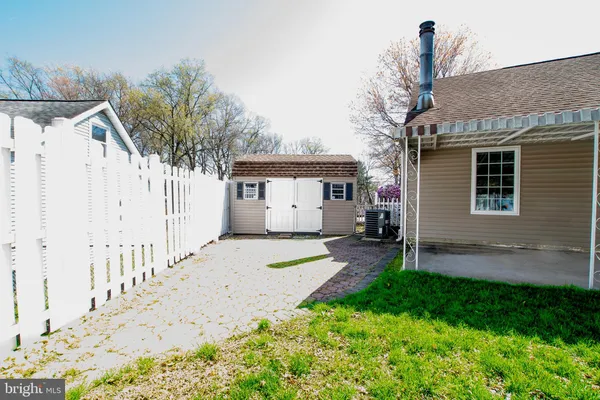 a front view of a house with a yard and porch