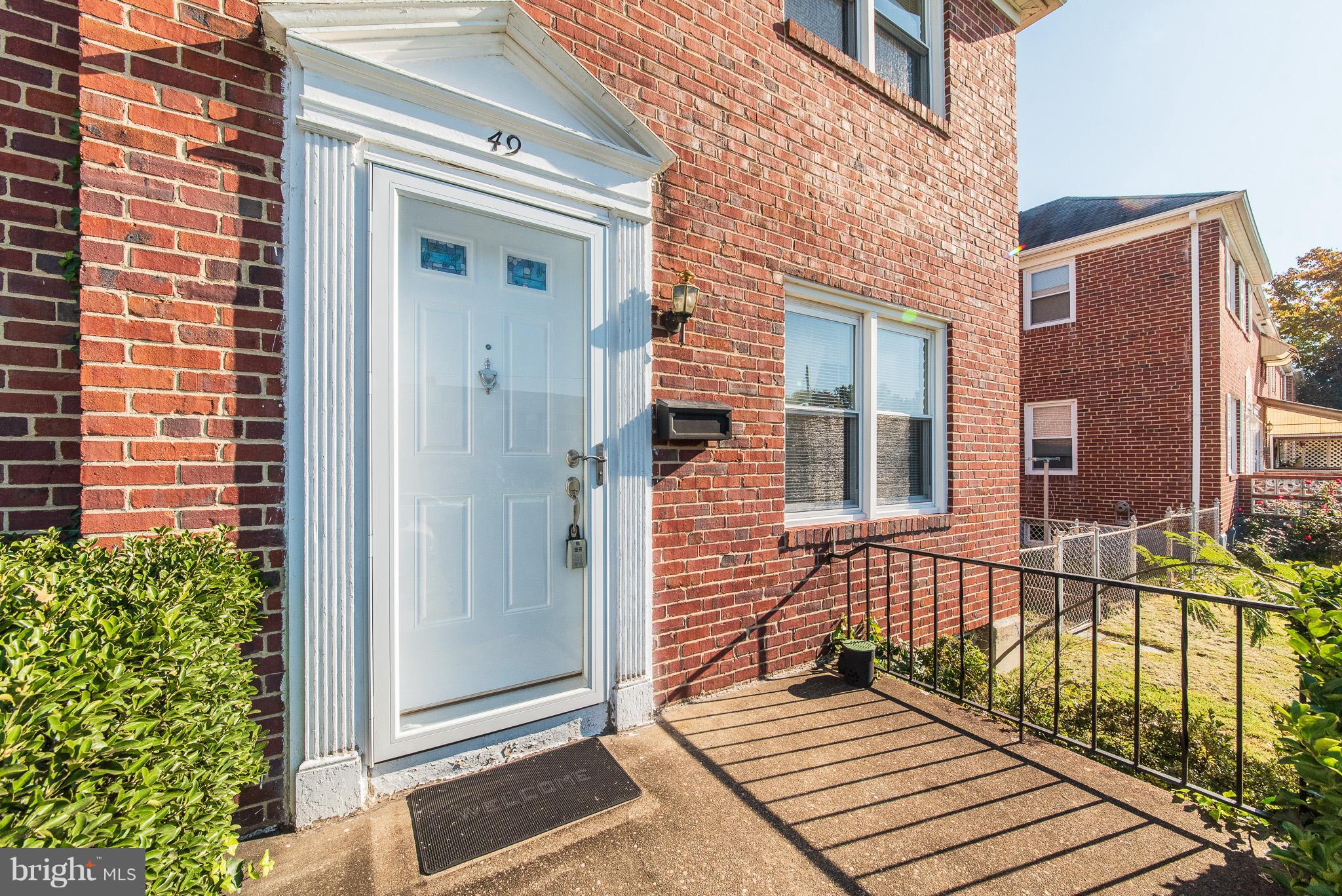49 Hawthorne Road Baltimore, MD 21220 - Photo 2 of 31 a view of a brick buildings with entryway doors
