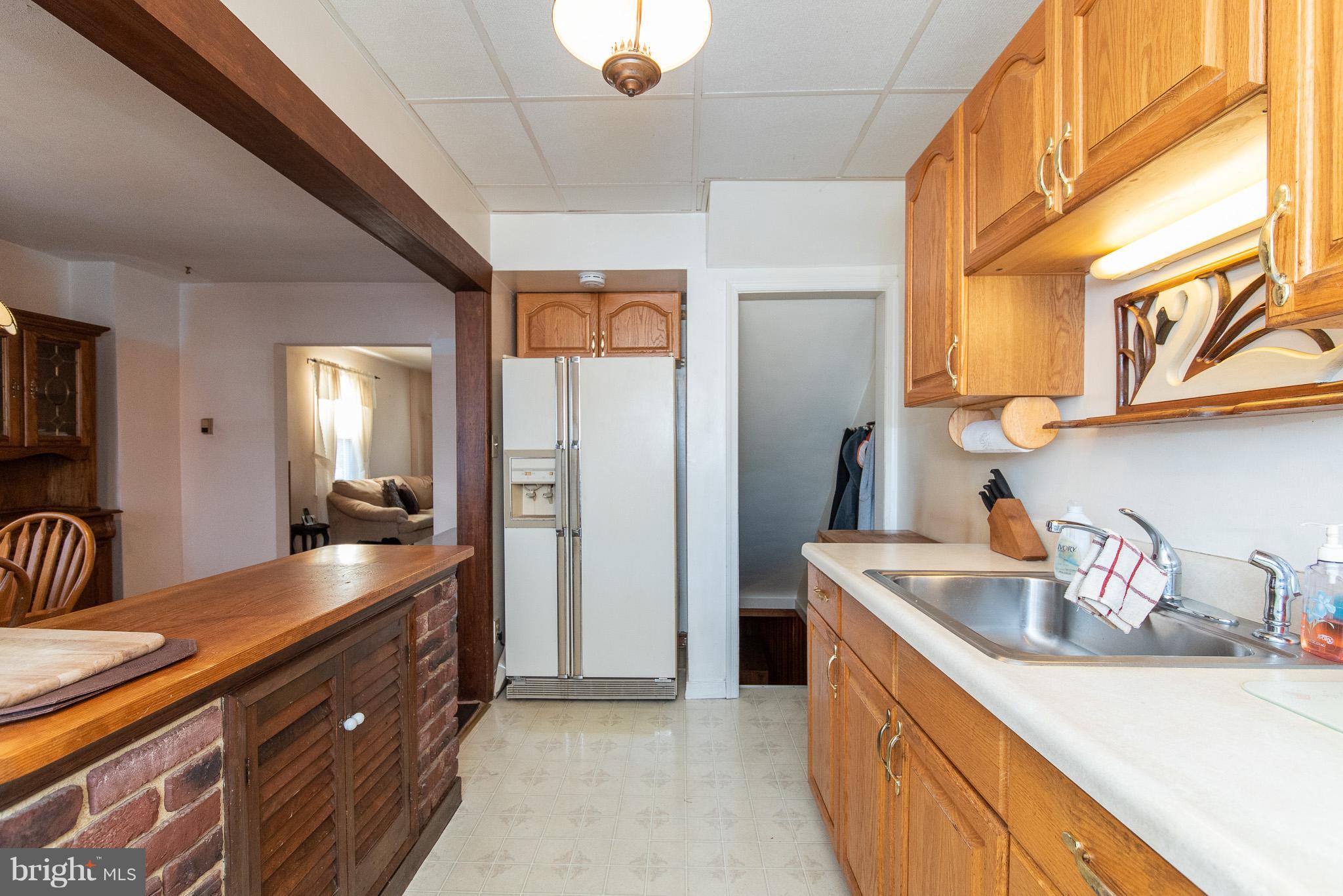 49 Hawthorne Road Baltimore, MD 21220 - Photo 12 of 31 a kitchen with stainless steel appliances granite countertop a sink and a refrigerator