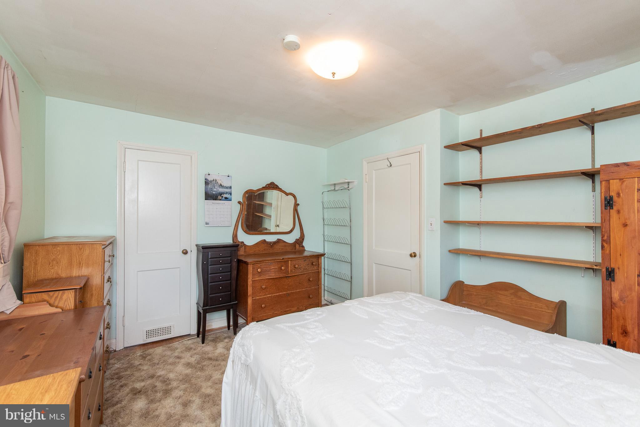 49 Hawthorne Road Baltimore, MD 21220 - Photo 17 of 31 a bedroom with a bed and a dresser in it
